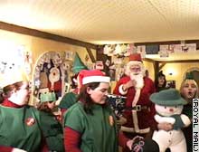 Royal Mail webcam shows Santa and his elves wrapping toys and answering letters.