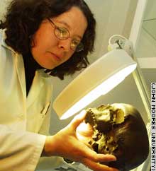 Geologist Silvia Gonzalez studies an ancient cranium.