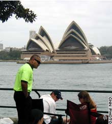 A security guard checks the bags of New Year's revellers on Sydney's foreshore