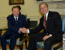 President Bush, right, greets President Rudolf Schuster of the Slovak Republic in the Oval Office of the White House on Wednesday.