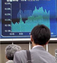 Japan's market ended Friday below 13-month highs set a day earlier.