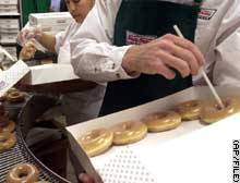 Weighty treat: The doughnuts are traditionally sold in dozens.