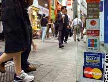 Credit card companies have been hit by action to deflate a credit bubble.
