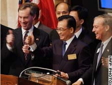 Wen gestures after ringing the opening bell at the New York Stock Exchange.