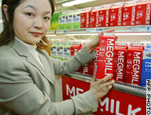 Snow Brand Milk shares jumped 32 percent Friday after the dairy company won a debt waiver