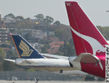Qantas says it will axe the equivalent of 1,000 jobs.