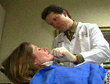 Dr. Brian Maloney performs a cosmetic procedure on Robin Allman. Maloney cautions against using products that haven't received FDA approval.