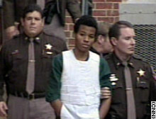 Lee Boyd Malvo, center