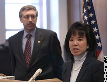 U.S. Attorney Debra W. Yang, with FBI agent Leslie Wiser Jr., at a news conference to announce the arrest of a former FBI special agent and a Chinese double agent.