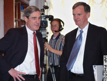 Robert Mueller, FBI Director, left, with Sen. Judd Gregg, R-New Hampshire, before Thursday's Senate subcommittee hearing.