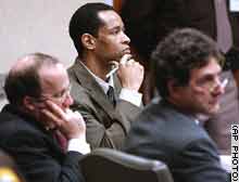 Muhammad, center, listens to court testimony Tuesday as his standby counsel, Peter Greenspun, left, and Jonathan Shapiro listen.