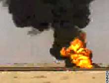 Fire rages Friday at an oil field in southern Iraq.