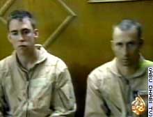 Chief Warrant Officers Ronald D. Young Jr., left, and David S. Williams were filmed after their capture.