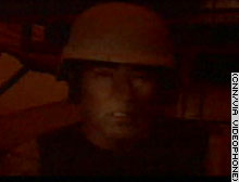CNN's Walter Rodgers reports by videophone, and his use of lights is severely restricted.