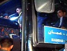 Passengers board a bus heading to Baghdad, after stopping on the way at Abu Saif's for supper.