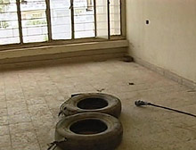 The old tires protected the torturer while the victim stood on a wet floor and was electrocuted, a BBC reporter was told.