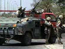 U.S. soldiers secure the site of Monday's attack in Baghdad.
