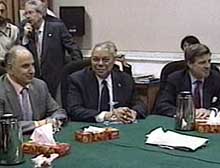 Powell, center, joins U.S. civilian adminstrator L. Paul Bremer, right, at meeting Sunday in Baghdad..