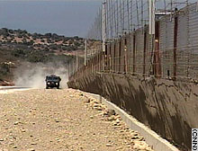 Israel says the barrier is intended to block terrorists from entering. Palestinians call it a land grab.